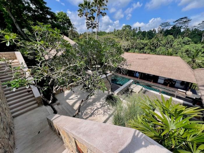 COMO Shambhala Estate stone villa facade with thatched roof, Ubud Bali