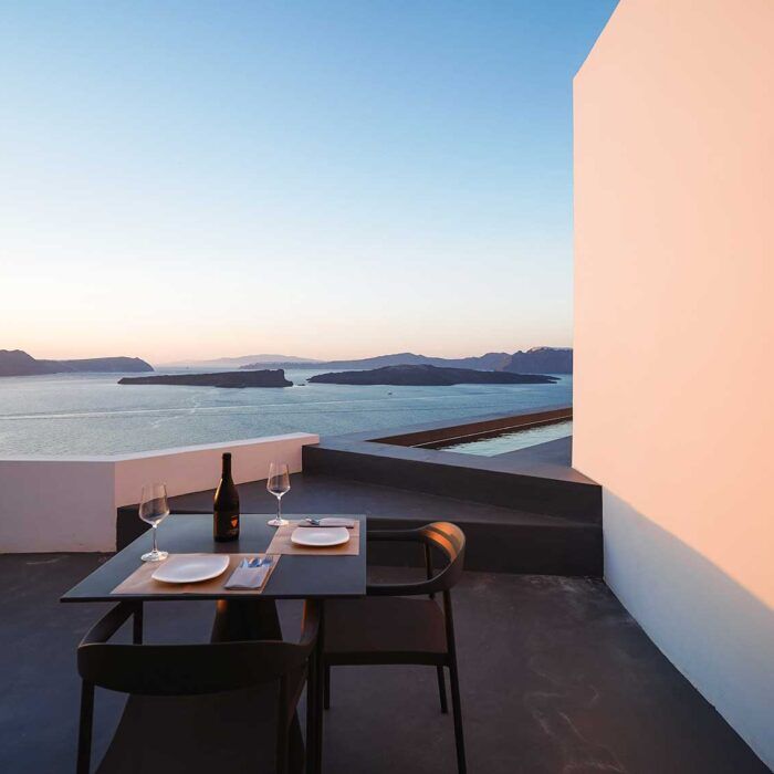 Santonero candlelit outdoor dining with caldera view, Santorini